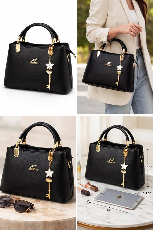 Leather top handle handbag with gold key charm from Lace & Luxe, featuring a structured shoulder bag design with elegant detailing.