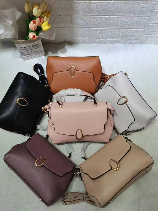 Lace & Luxe leather crossbody bag with multiple compartments, adjustable strap, and minimalist design for versatile everyday use.