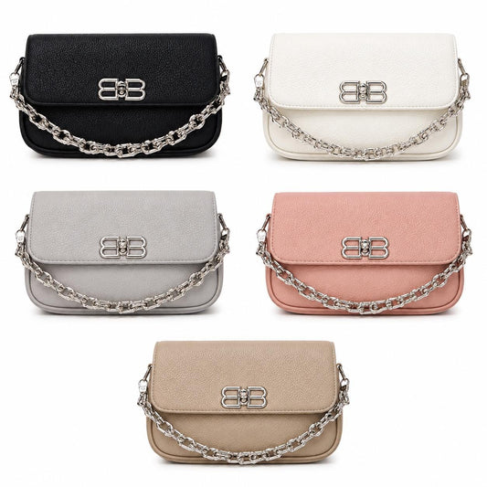 Black leather shoulder bag for women with chain strap, mini flap design, stylish evening handbag by Lace & Luxe.