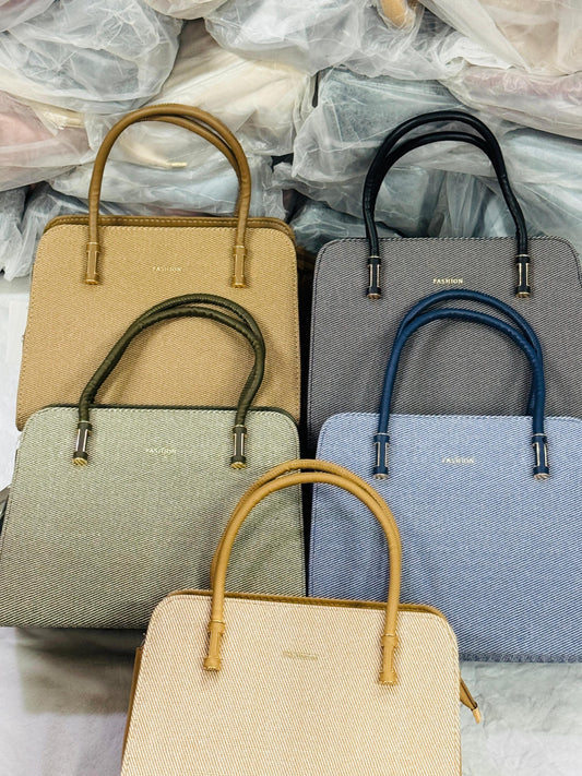 Lace & Luxe tote handbag with shoulder straps, spacious everyday bag in neutral fabric with minimal design and sturdy handles.