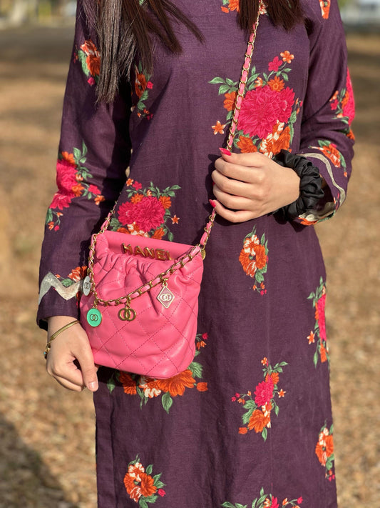 Hot pink quilted faux leather crossbody bag with gold chain shoulder strap by Lace & Luxe, featuring a sleek, stylish design.