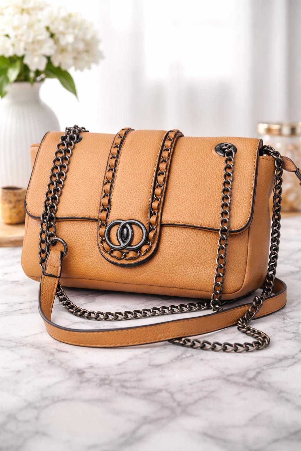 Lace & Luxe leather chain shoulder bag with woven chain trim and flap crossbody design, stylish and compact for everyday use.