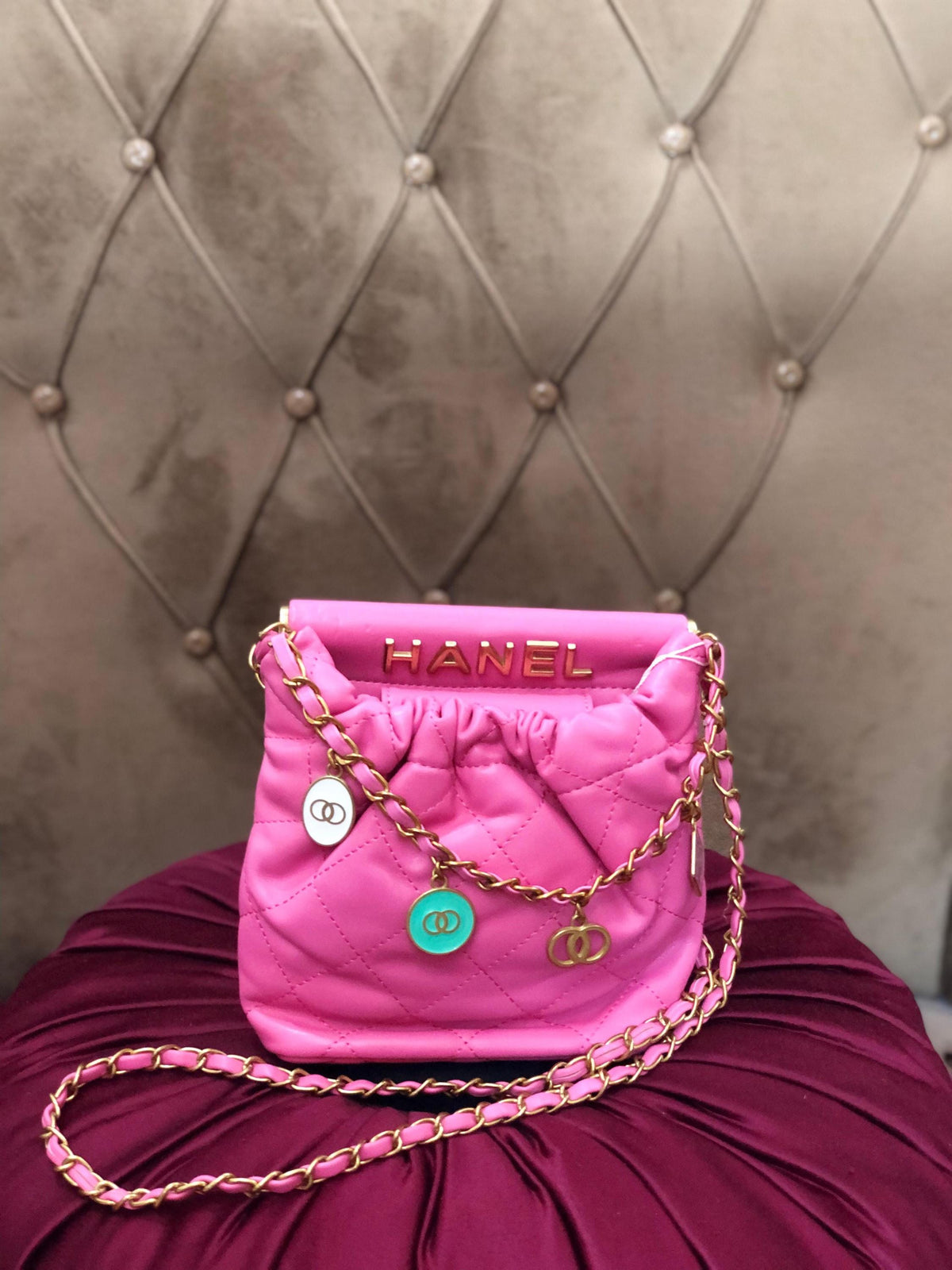 Hot pink quilted faux leather crossbody bag with gold chain shoulder strap from Lace & Luxe, featuring a stylish, textured design.
