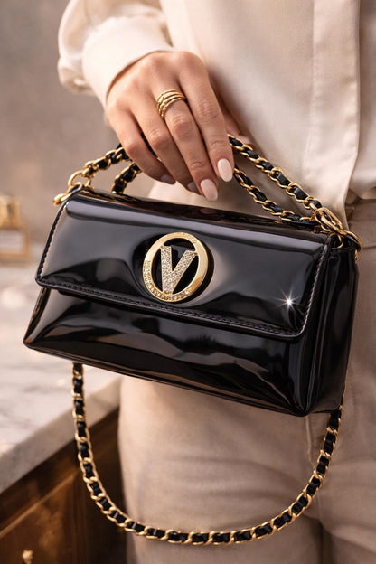 Black patent leather evening clutch with gold chain strap and crystal V clasp, stylish purse by Lace & Luxe