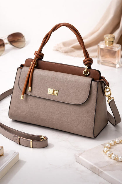 Lace & Luxe pebbled leather handbag with structured top handle and crossbody strap, stylish women's purse in black.