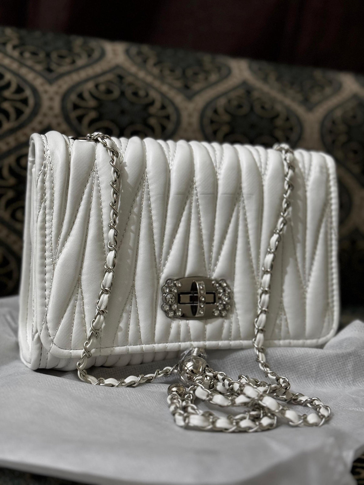 Lace & Luxe leather quilted mini bag with chain crossbody strap, featuring a compact purse design and elegant stitching.