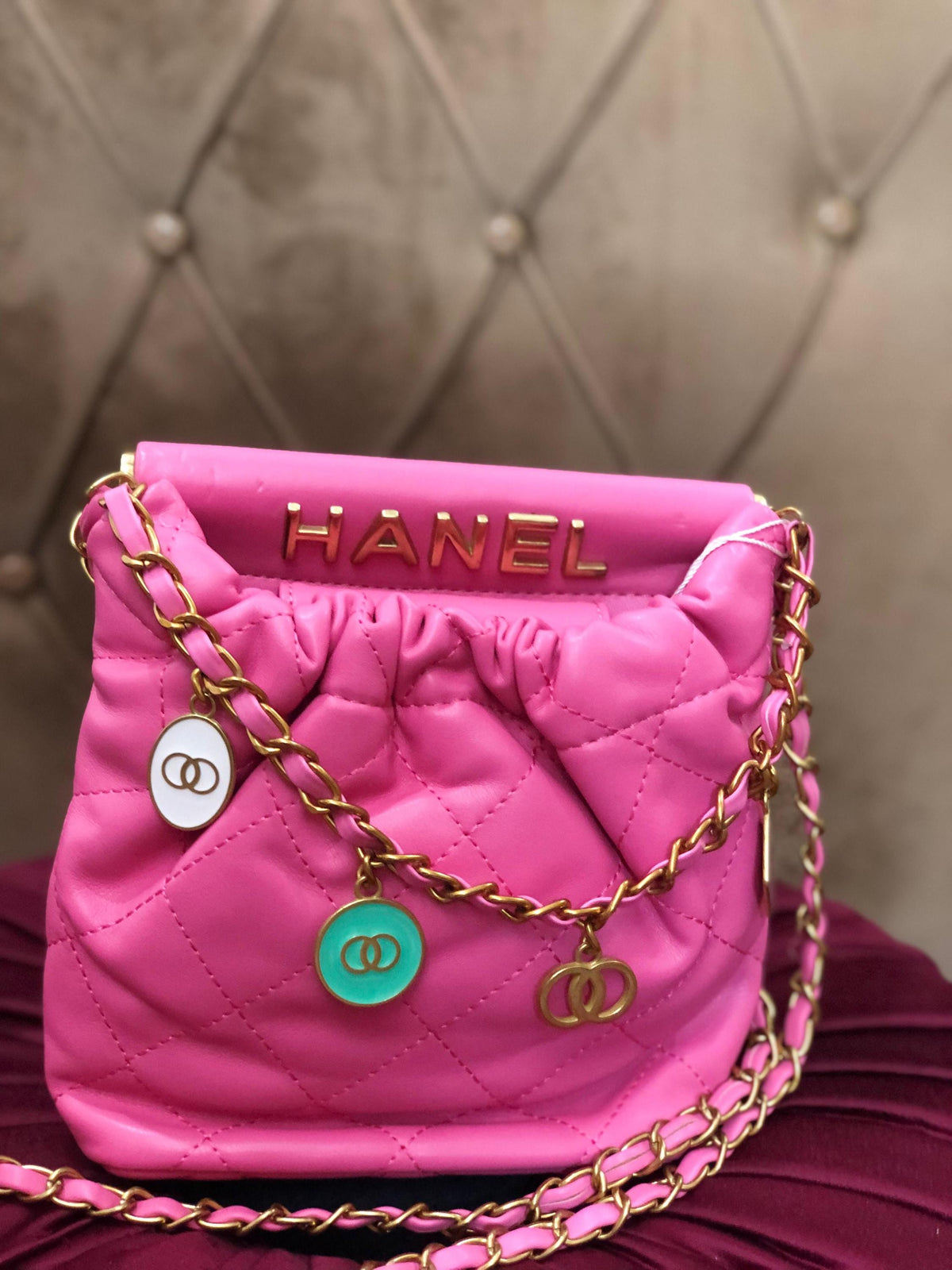 Hot pink quilted faux leather crossbody bag with gold chain shoulder strap from Lace & Luxe, featuring a sleek, stylish design.