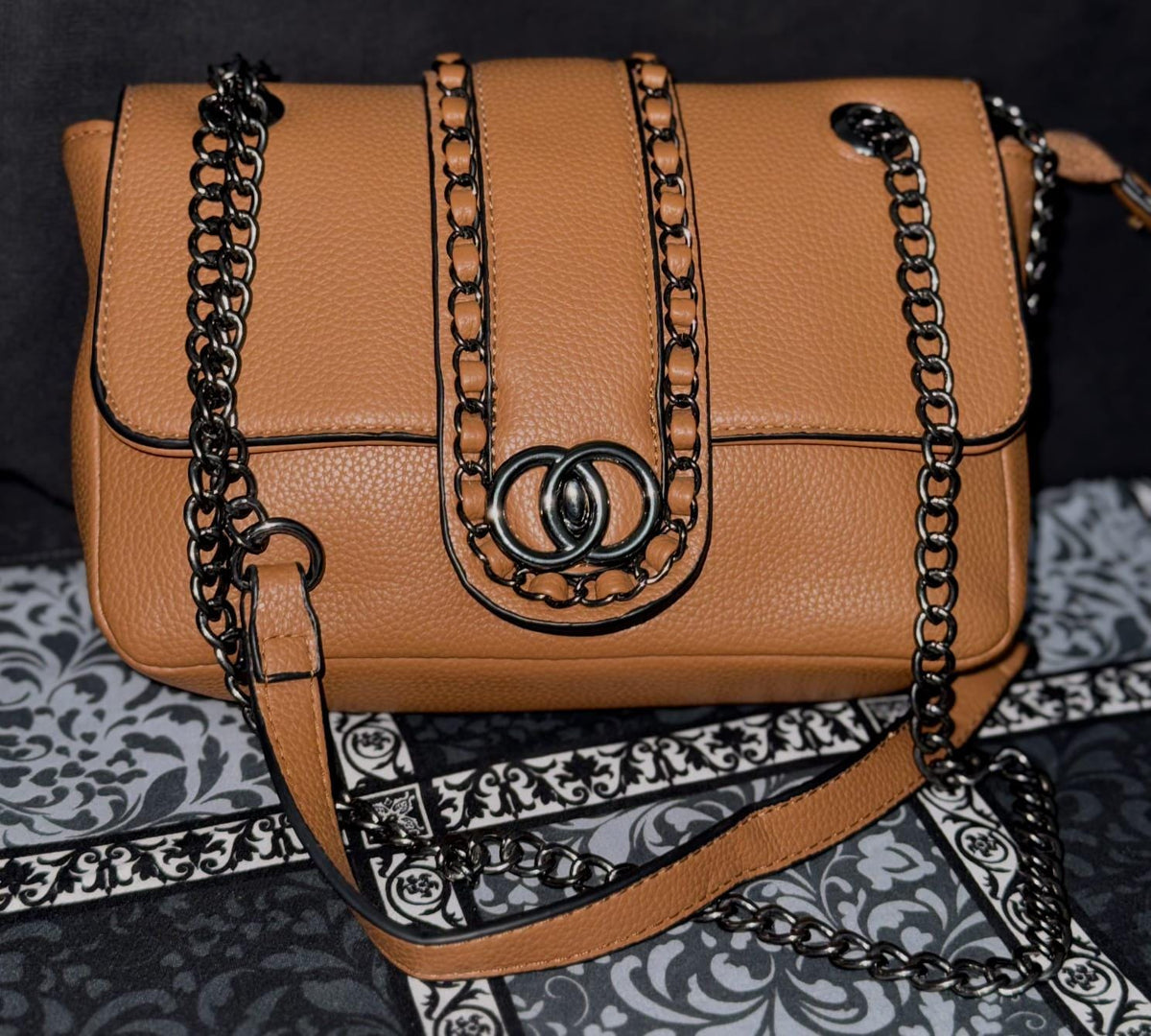 Lace & Luxe leather chain shoulder bag with woven chain trim and flap crossbody design, stylish and compact purse.