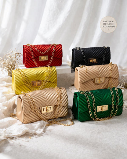 Lace & Luxe quilted chevron pattern crossbody bag with gold chain shoulder strap and compact handbag design.