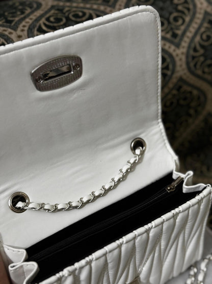 Lace & Luxe leather mini quilted chain crossbody and shoulder purse with gold-tone chain strap and compact design.
