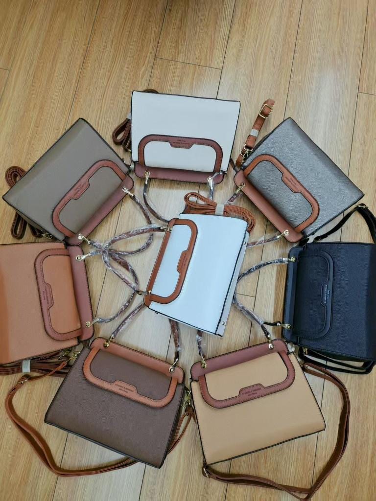 Lace & Luxe pebbled leather handbag with structured top handle and crossbody strap, versatile purse for women.