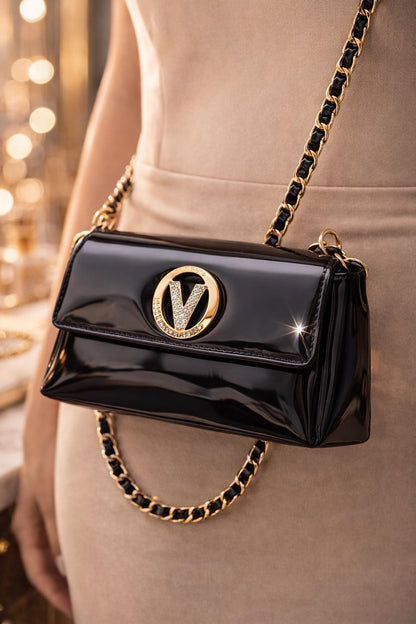 Black patent leather evening clutch with gold chain strap and crystal V clasp, stylish Lace & Luxe purse for formal occasions
