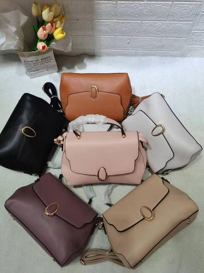 Lace & Luxe leather crossbody bag with multiple compartments, adjustable strap, and minimalist design for versatile everyday use.
