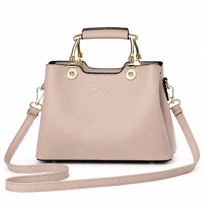Blush pink structured satchel handbag with gold hardware, vegan leather top handle, and crossbody strap for women by Lace & Luxe
