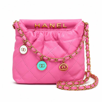 Hot pink quilted faux leather crossbody bag with gold chain shoulder strap from Lace & Luxe, showcasing its stylish design and textured surface.
