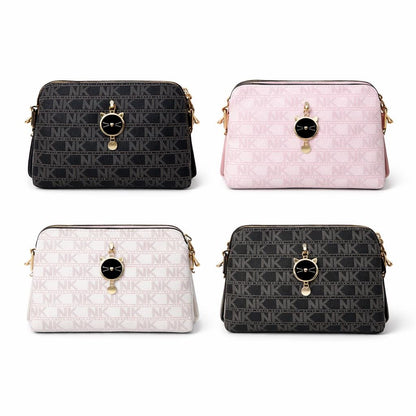 Black monogram crossbody bag with cat charm and small pattern, designed for women by Lace & Luxe.