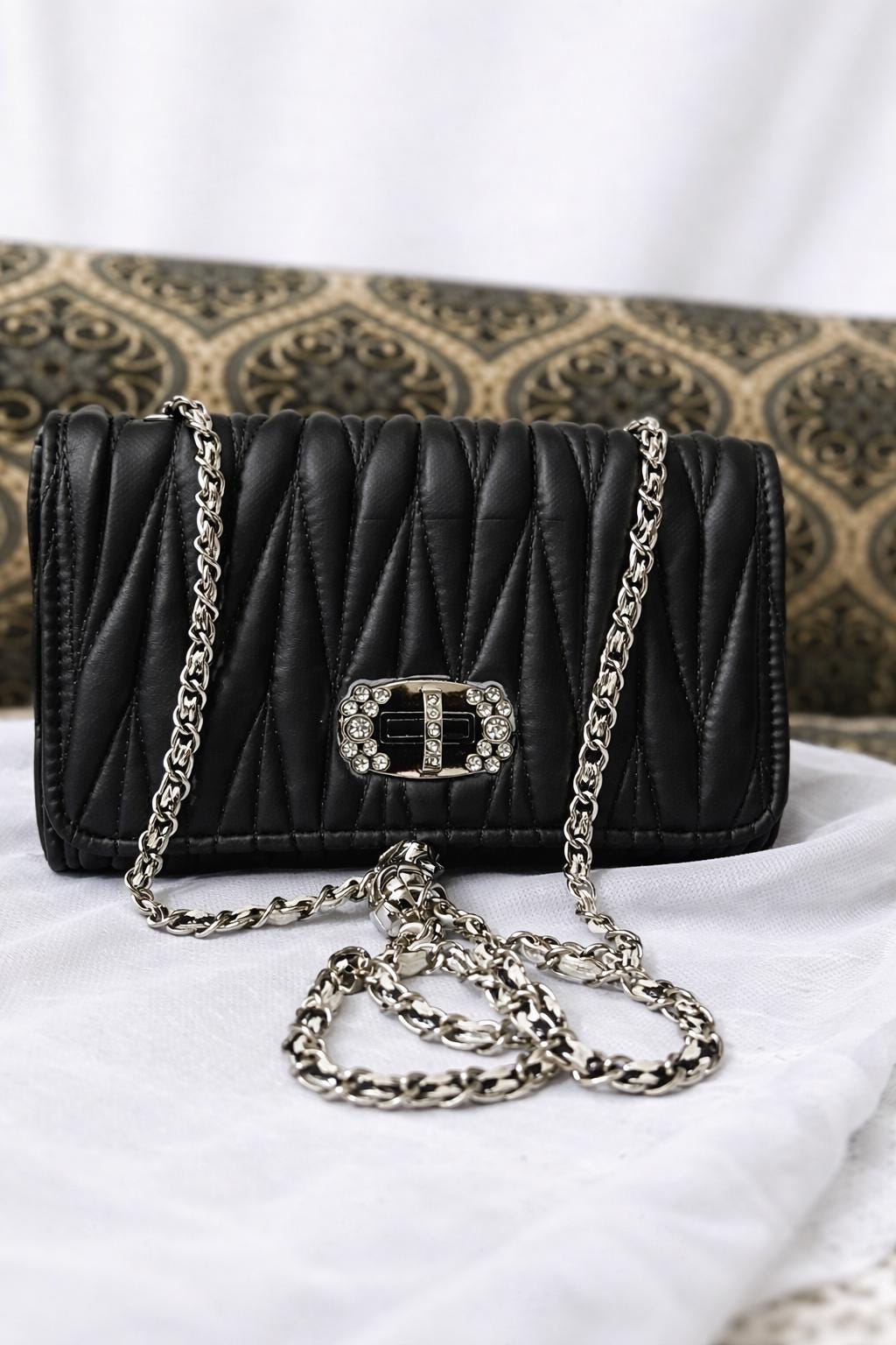 Lace & Luxe leather mini bag with quilted design, chain strap, and versatile crossbody and shoulder purse style.