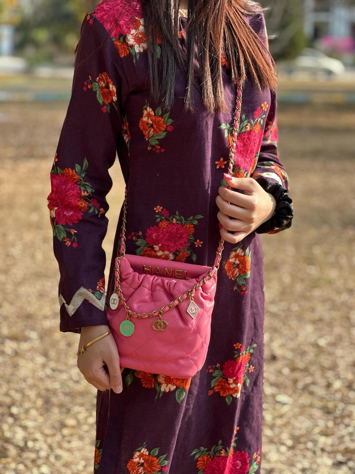 Hot pink quilted faux leather crossbody bag by Lace & Luxe with a gold chain shoulder strap and stylish design.