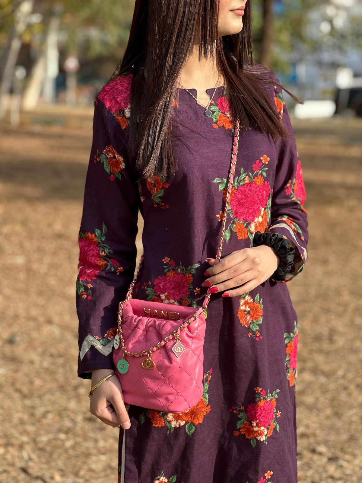 Hot pink quilted faux leather crossbody bag with gold chain shoulder strap by Lace & Luxe, featuring a sleek and stylish design.