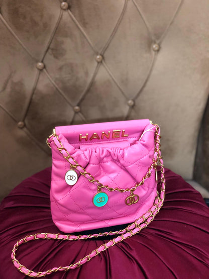 Hot pink quilted faux leather crossbody bag with gold chain strap from Lace & Luxe, featuring a stylish shoulder purse design.