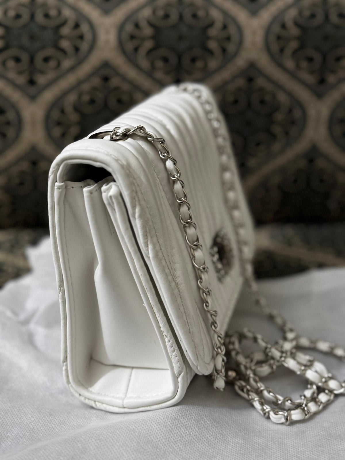 Lace & Luxe quilted leather mini bag with chain strap, used as crossbody or shoulder purse, featuring stylish design and compact size.
