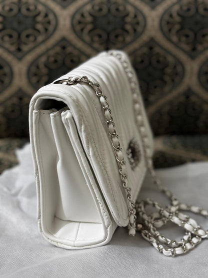 Lace & Luxe quilted leather mini bag with chain strap, used as crossbody or shoulder purse, featuring stylish design and compact size.