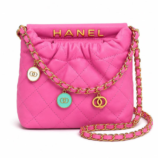 Hot pink quilted faux leather crossbody bag with gold chain shoulder strap by Lace & Luxe, featuring a stylish compact design.